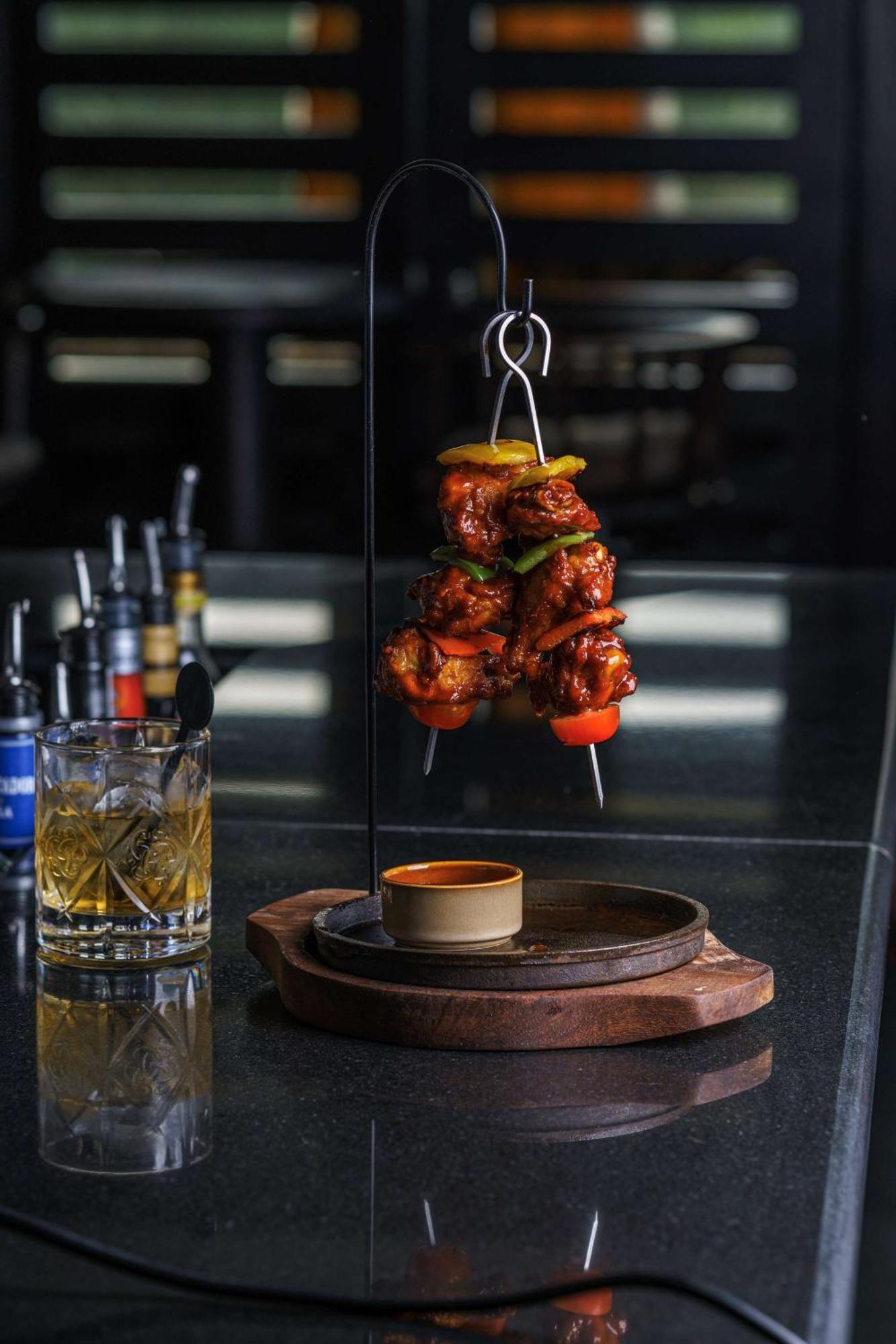 Radisson Blu Hotel & Resort, Sohar Ngoại thất bức ảnh A chicken tikka served on a skewer
